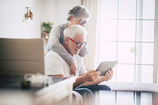 Older couple looking at tablet